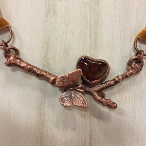 Butterfly, heart and twig pendant